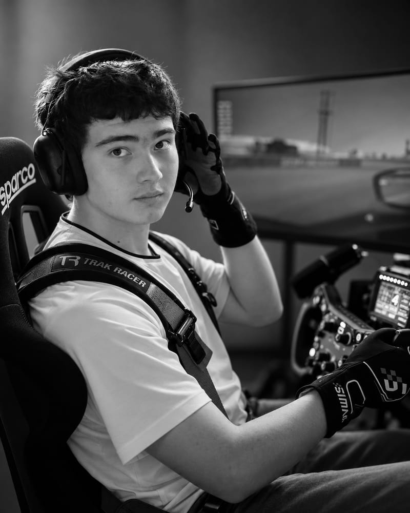 Artem Fedorov wearing a headset in a racing simulator